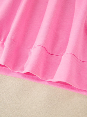 Pink cotton bikini bottoms with drawstring detail and ruffled hem