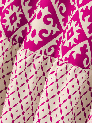 Tiered maxi skirt in hot pink and beige medallion print with ruffled tiers.