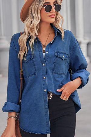 Oversized dark wash denim shirt with patch pockets, collared neckline, and button front.