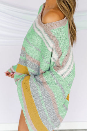 Open-shoulder striped knit pullover in Gum Leaf with a boatneck and crochet trim detail.