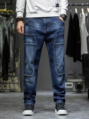 Men's dark blue 100% cotton cargo jeans with relaxed fit and utility pockets.