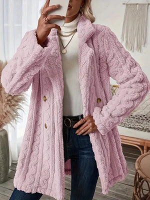 Pink faux shearling double-breasted overcoat with cable knit texture and button closure.