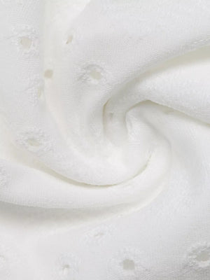 White eyelet lace detail maternity shirt fabric close-up