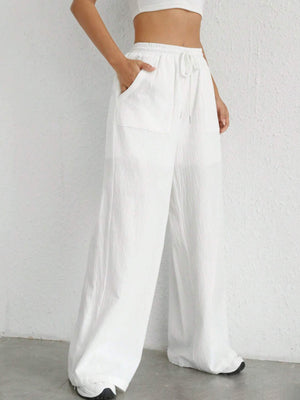 White linen wide-leg drawstring trousers with side pockets