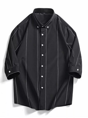 Black oversized cotton button-down shirt with white vertical pinstripes and white buttons.