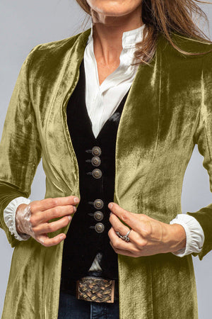 Velvet duster coat in champagne color with a dramatic split back, open front, and ornate buttons on vest.