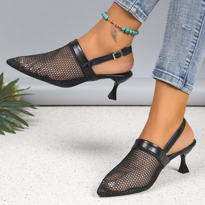 Black mesh kitten heel sandals with pointed toe and slingback strap.