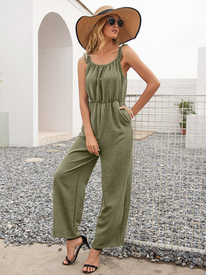 Matcha green textured wide-leg jumpsuit with ruffled straps and elastic waist.