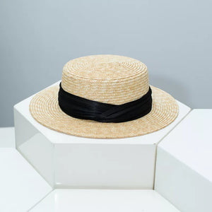 Straw boater hat in tan with black ribbon trim