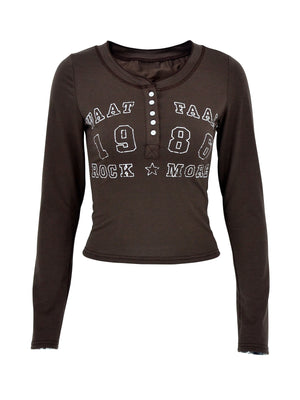 Brown long sleeve t-shirt with button neckline and white letter graphic.