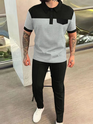 Colorblock polo shirt and track pants set in gray, black, and dark gray with a chest pocket.