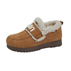Caramel suede shearling loafers with white logo strap detail.