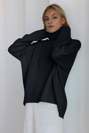 Black oversized cashmere turtleneck cocoon sweater with ribbed cuffs and hem