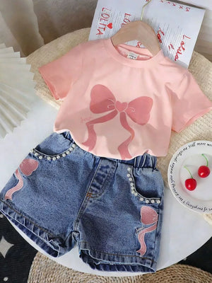 Blush pink bowknot tee with denim shorts featuring pearl trim and bowknot embroidery.