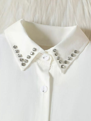 White toddler collar shirt with rhinestone trim and decorative button detail