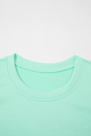 Mint green two-piece lounge set t-shirt with crew neck and visible stitching detail.