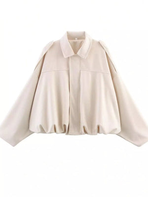 Oversized off-white zip-up jacket with a collared neckline and balloon sleeves.