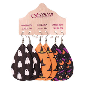 Spooky print teardrop earrings in black ghost, orange witch hat, and purple moon/eye patterns.