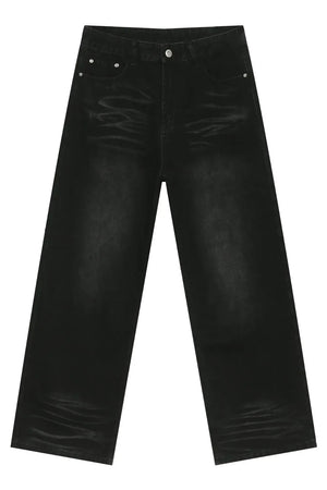 Faded black baggy denim trousers with a relaxed fit and visible whiskering details.