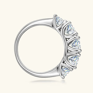 Silver band ring with five sparkling moissanite stones.