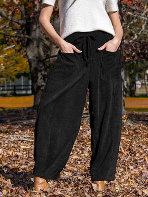 Black corduroy wide-leg pants with drawstring waist and pockets
