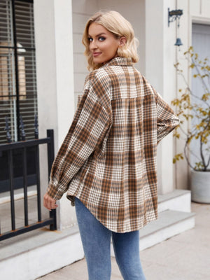 Oversized plaid shirt jacket in chocolate brown with buttoned front and pocket detail.