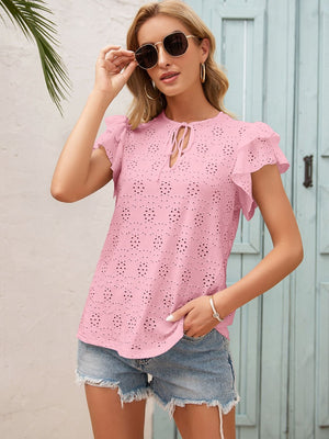 Blush pink eyelet blouse with ruffle sleeves and keyhole neckline.