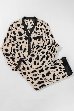 Animal print satin pajama set with button front top and drawstring pants in leopard.