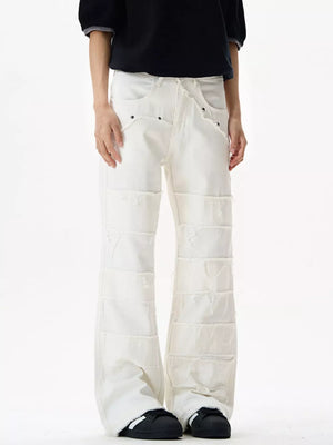 White stretch flare jeans with frayed hem detail and panel construction.