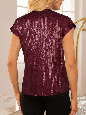 Burgundy sequin cap sleeve blouse with satin trim.