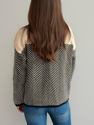 Chevron knit sweater with colorblock tan shoulders and black/white chevron pattern.
