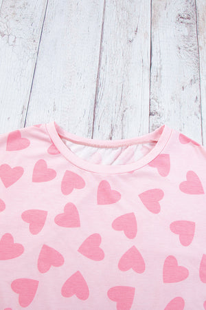 Blush pink pajama top with allover heart print and crew neck.