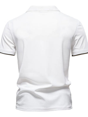 White polo shirt with dark trim on sleeves.