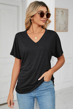 Drape-front v-neck tee in dark gray with short dolman sleeves and side ruching detail.