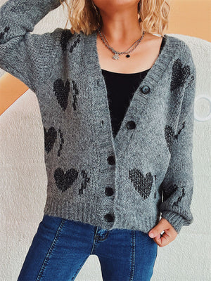 Dark gray knit cardigan with black heart motif, V-neck, button front, and long sleeves.