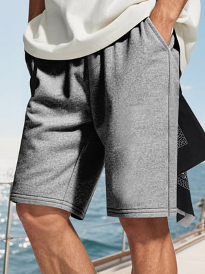 Men's heather gray drawstring casual shorts with side pockets.