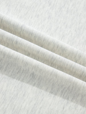 Light grey marled cotton casual top with button detail, showing fabric texture.