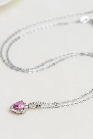 Pink heart halo pendant necklace in 925 sterling silver with clear accent stones.