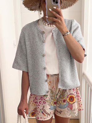 Gray ribbed button-down cardigan with short sleeves and a slightly cropped length.