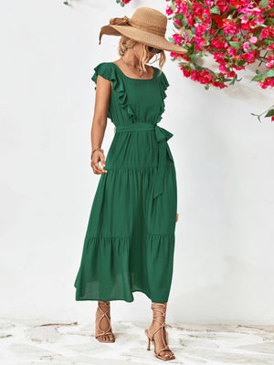 Forest green tiered midi dress with flutter sleeves and a belted waist.