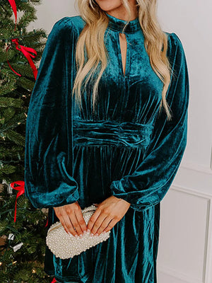 Peacock blue velvet mock neck dress with balloon sleeves and ruched waist detail.