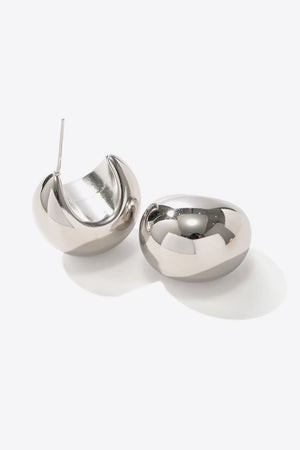 Sculptural silver crescent earrings with a polished finish