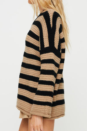 Chunky knit sweater with black and khaki stripes, boat neck, and long sleeves.