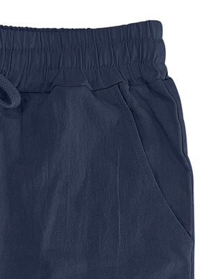 Navy blue drawstring sweatpants with elastic waistband and side pocket detail.
