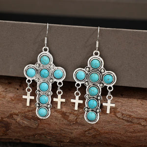 Southwestern turquoise cross dangle earrings with small cross charms.