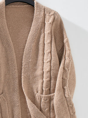 Tan knit cardigan with cable knit details and pockets.