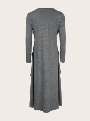 Dark gray midi dress with long sleeves, asymmetrical tiered hem, and pockets.