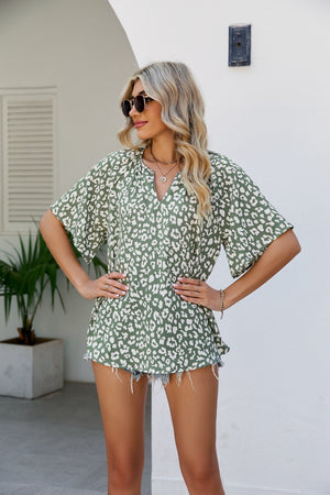 Army green leopard print v-neck blouse with short sleeves and a relaxed fit.