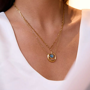Elegant 18k gold-plated layered necklace with blue stone pendant and chain detail.