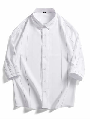 White oversized cotton button-down shirt with pinstripe pattern and button cuffs.